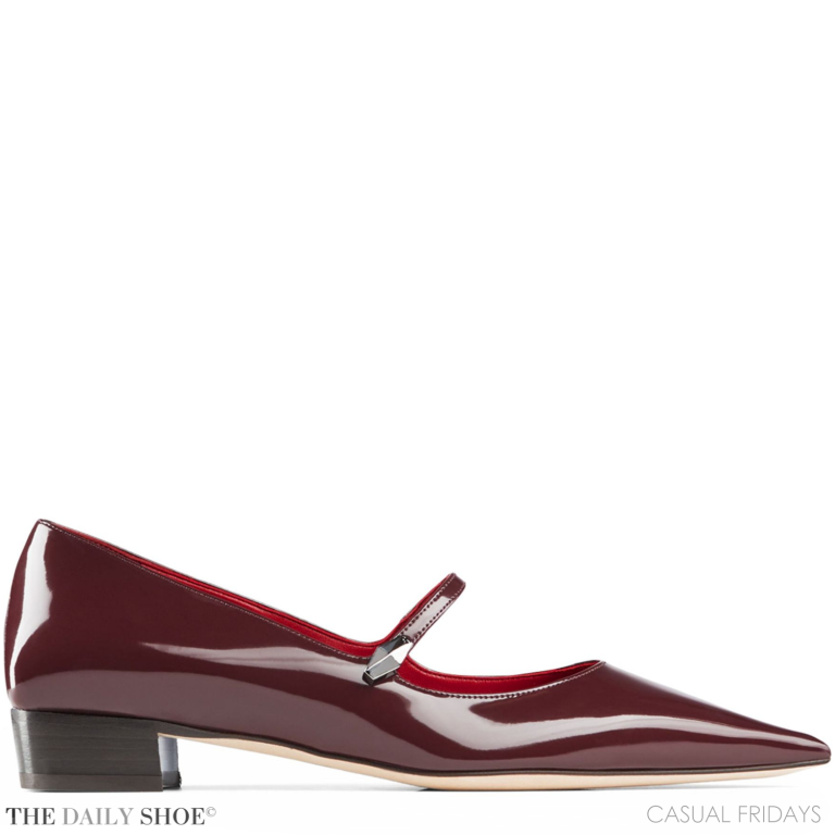 Jimmy Choo Carolyn pumps in burgundy patent leather with a pointed toe and block heel.