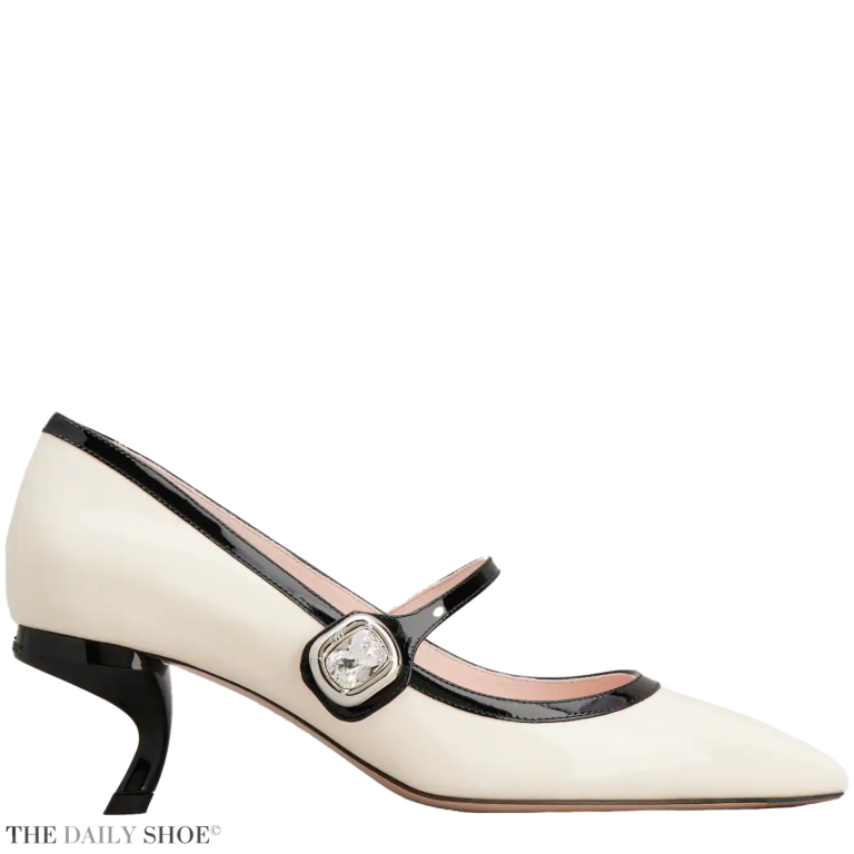 A pair of off-white Roger Vivier Virgule Mary Jane pumps with a black trim and a crystal button strap.